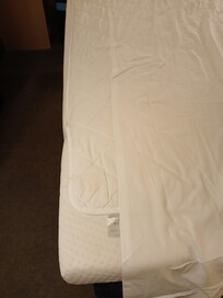 Sheet too short and mattress topper didn't stay in place, overhanging the base.