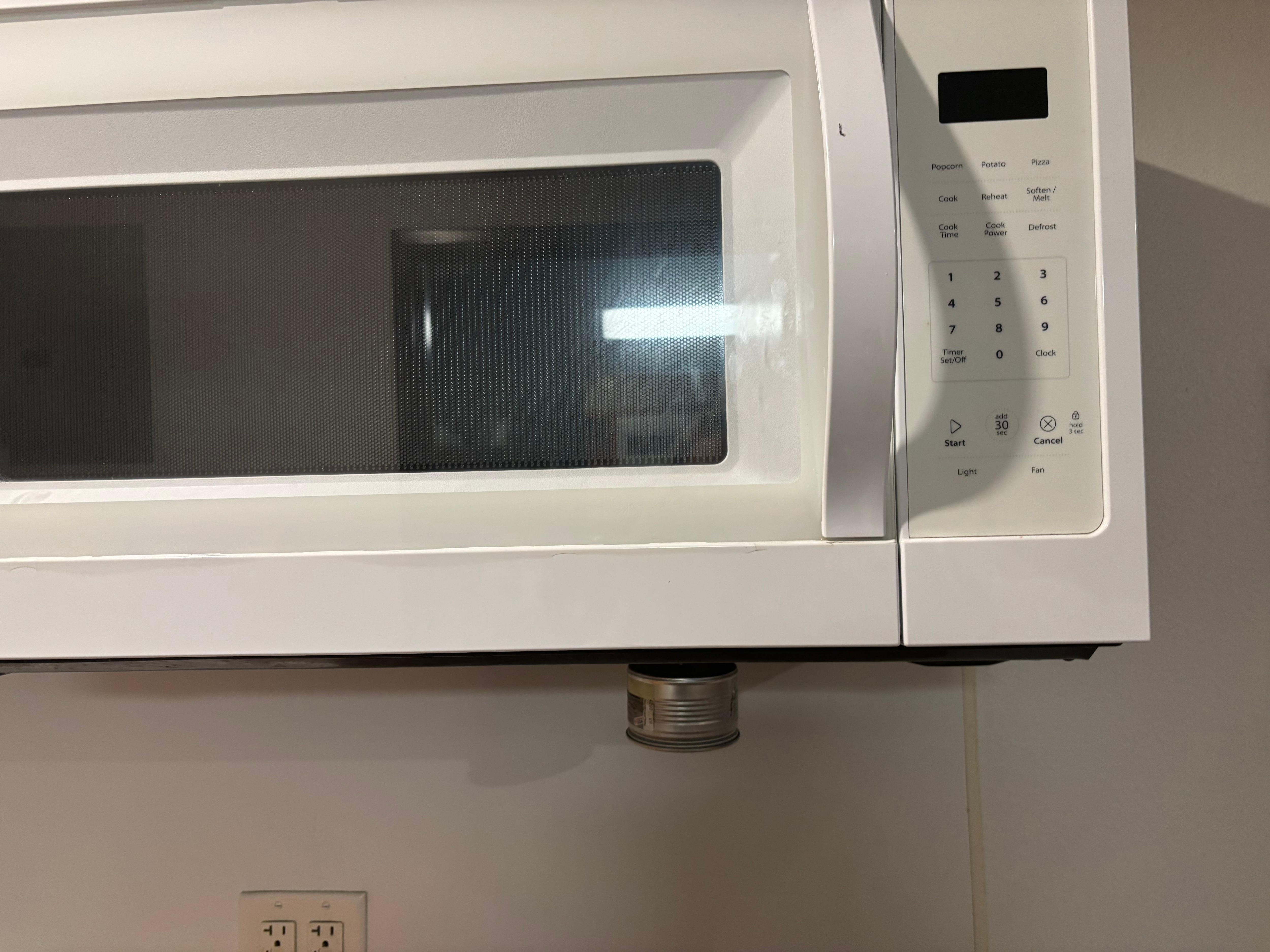 Part of microwave falling out of bottom 
