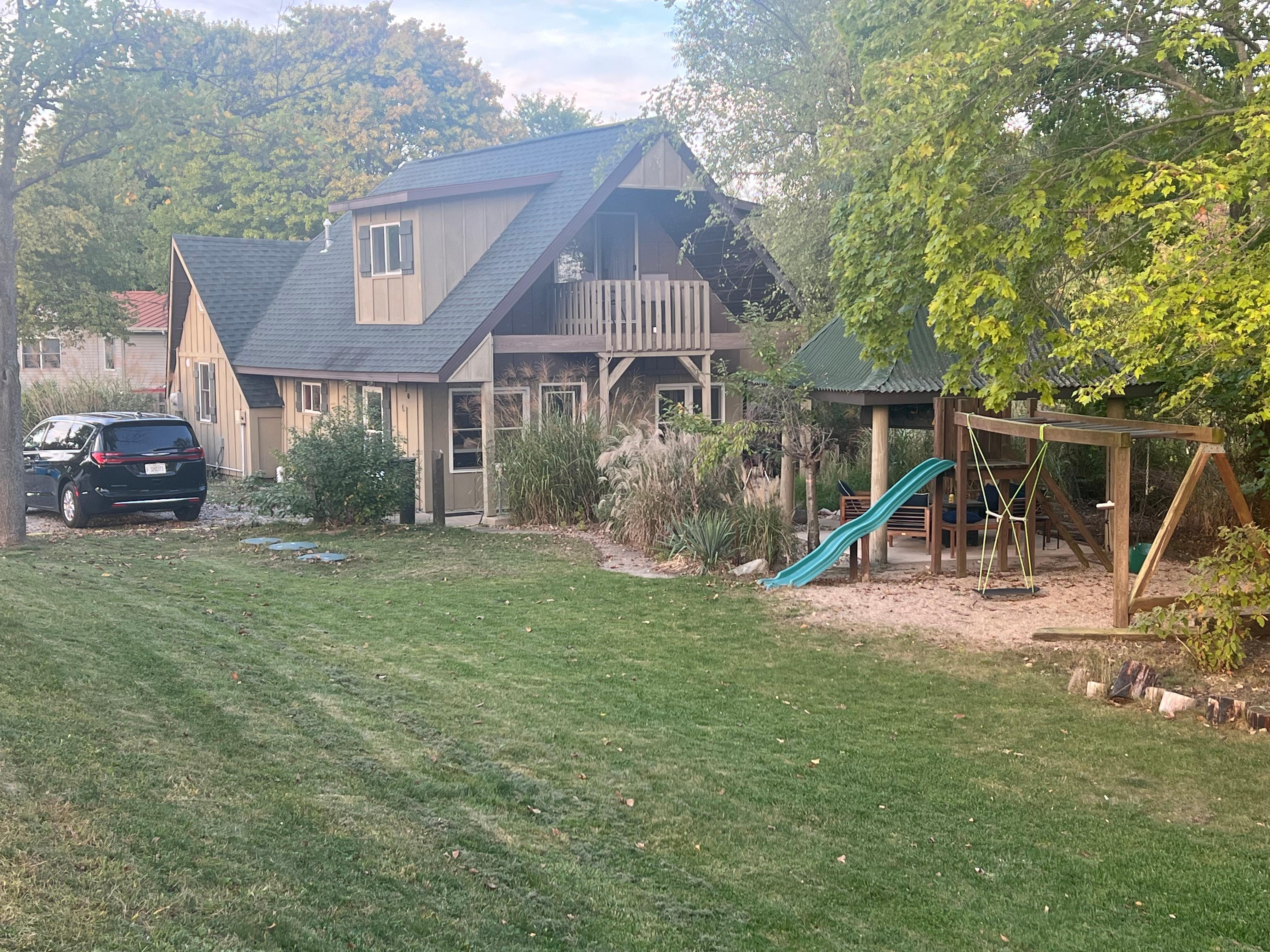 Looking back from lake to house. Note kids swings.