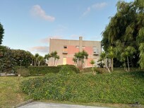 View of hotel from the private parking lot.