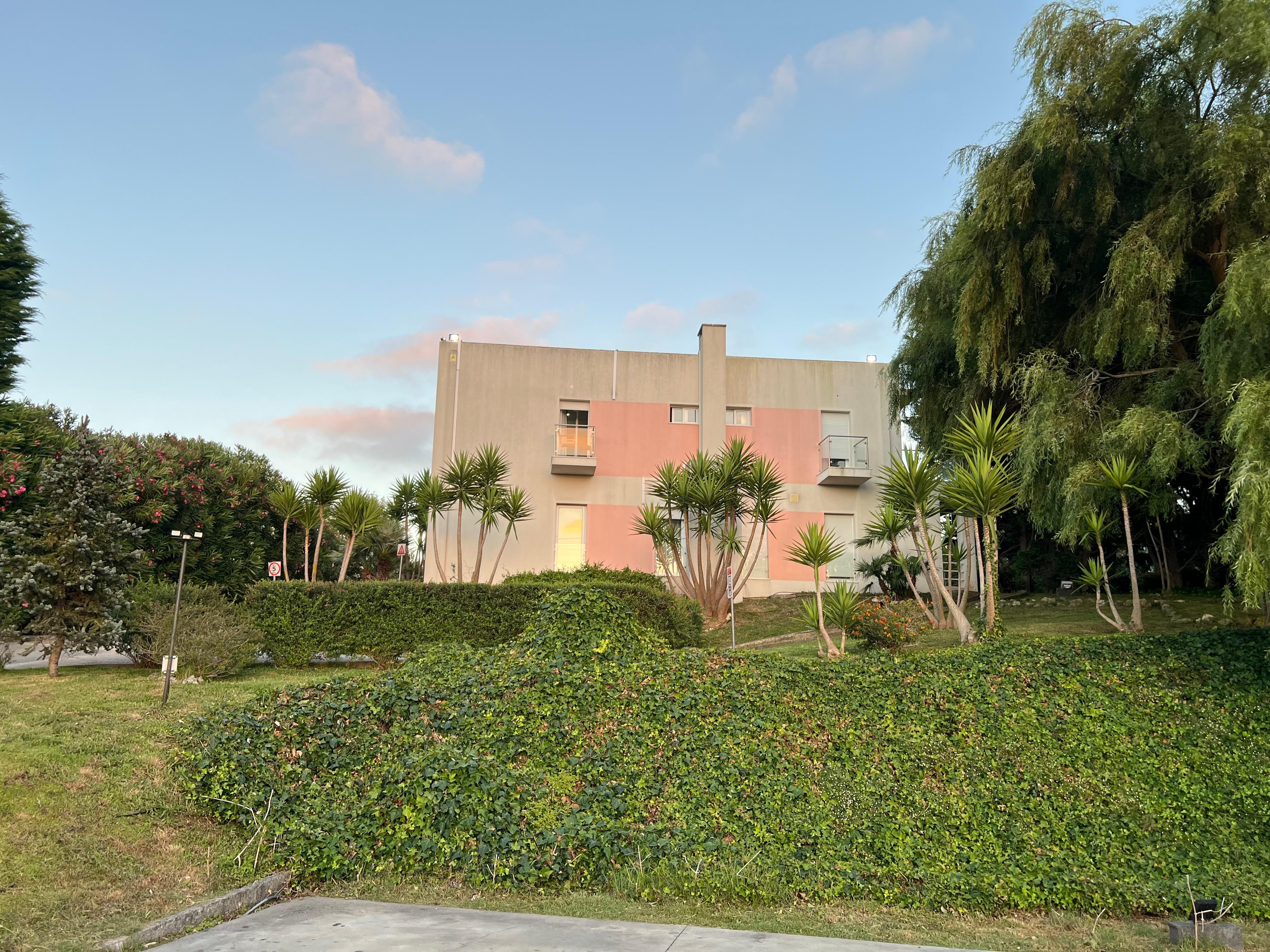 View of hotel from the private parking lot.