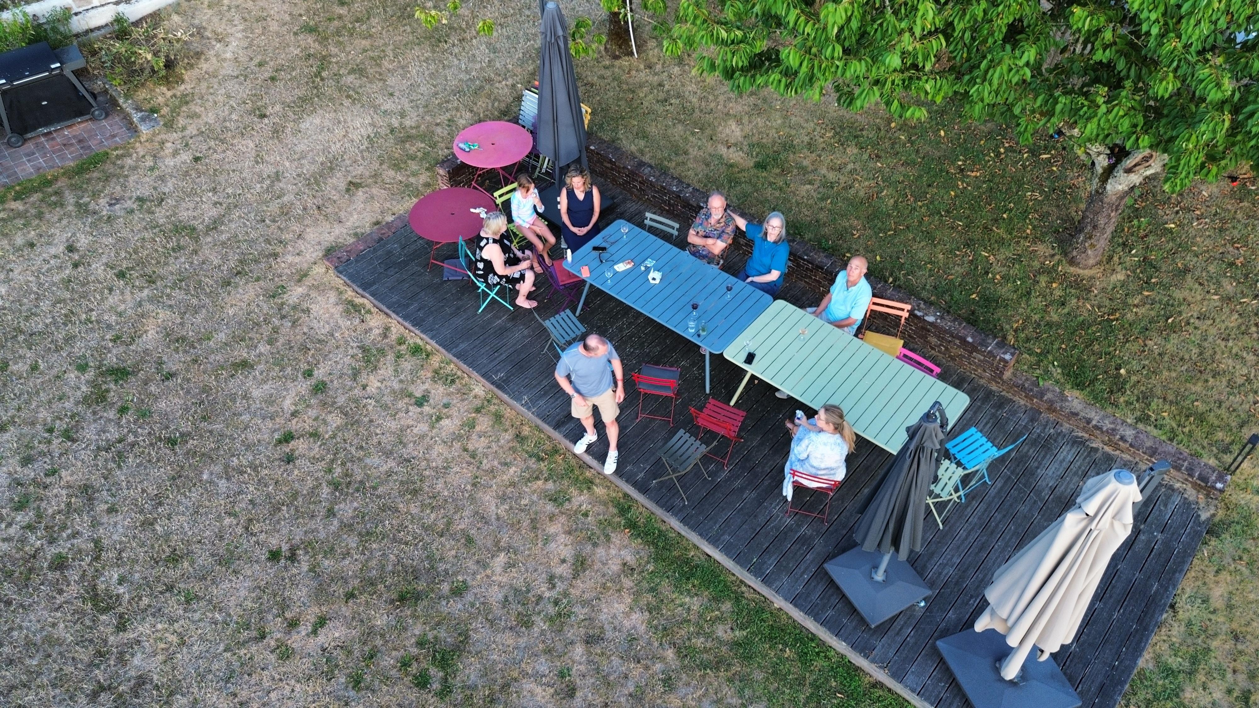 Enjoying wine at the outdoor table.