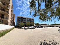 Parking in front of building. Gated entry