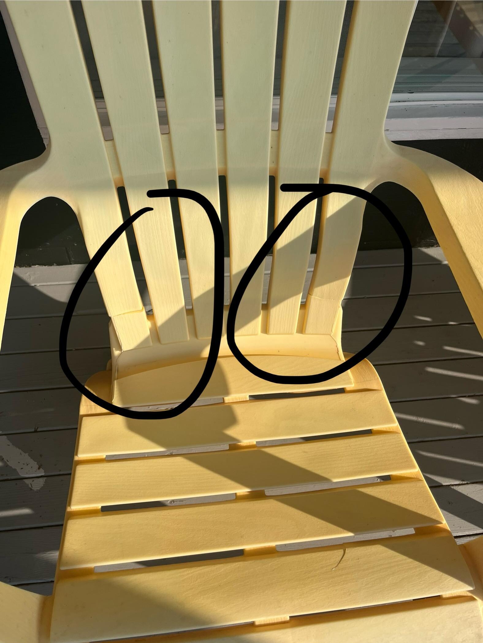 Many of the other faded, yellow chairs have clear signs of cracking