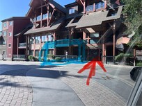 Unit is in blue box, main / only door into the complex is next door (the red arrow)