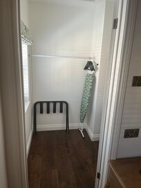 Walk in wardrobe area with a mini fridge and tea and coffee.