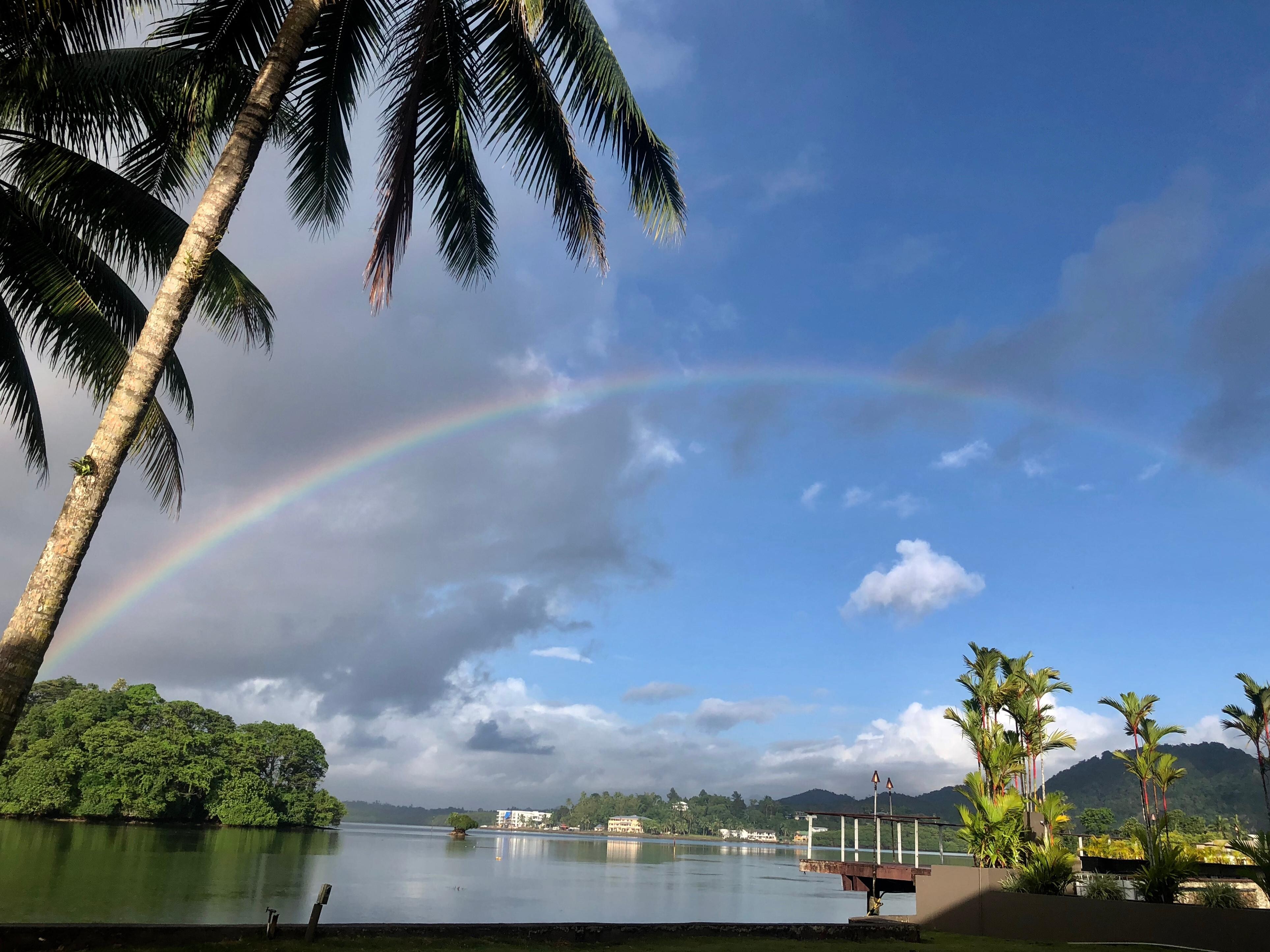View from the room of a rainbow over the water