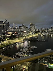 Beautiful night time view of city lights looking over the harbour.