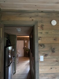 Hallway looking from bedroom thru kitchen to living room.
