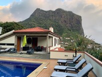 Pool area and lounge chairs.