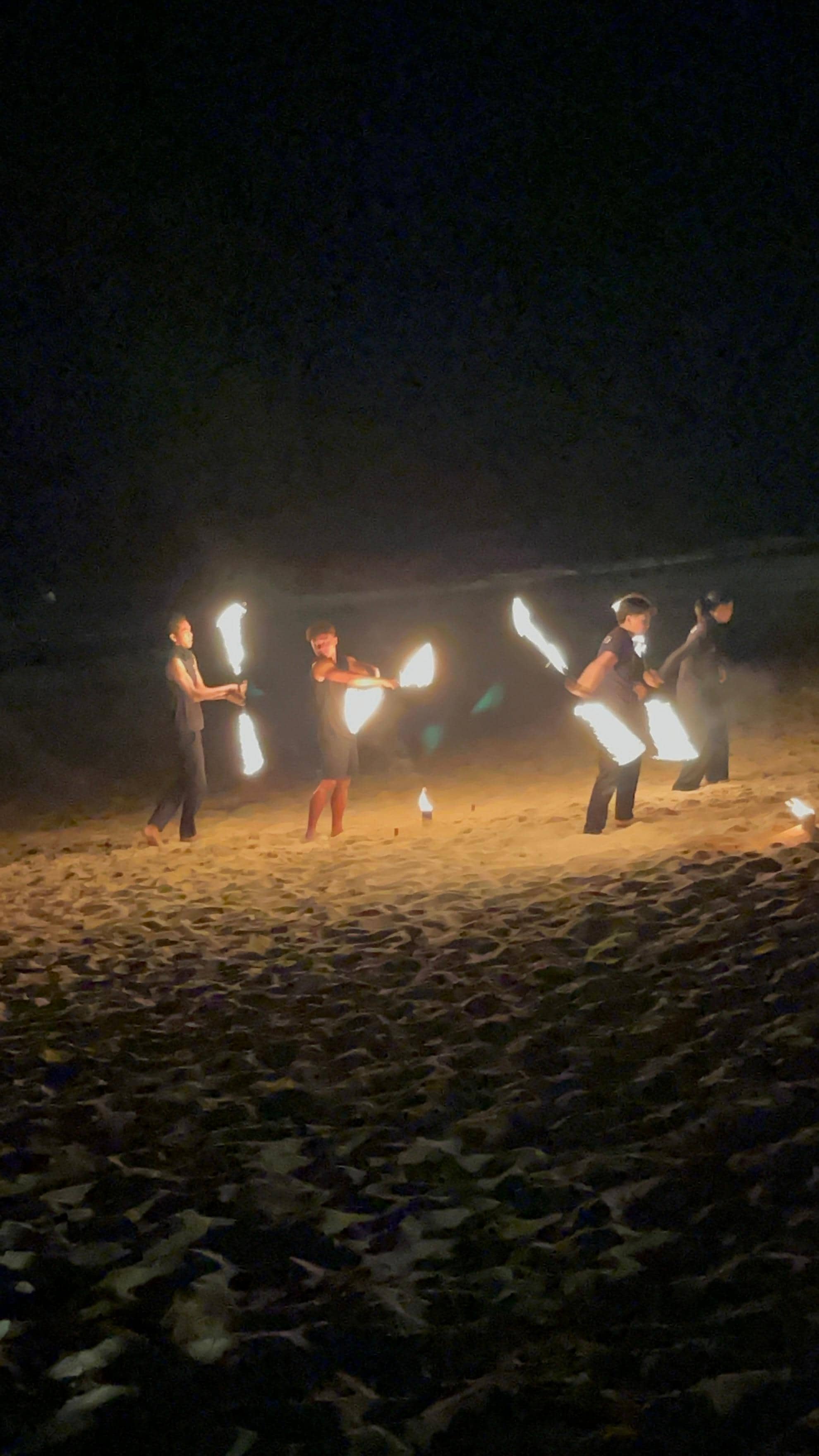 Fire show entertainment on the beach restaurant one night 