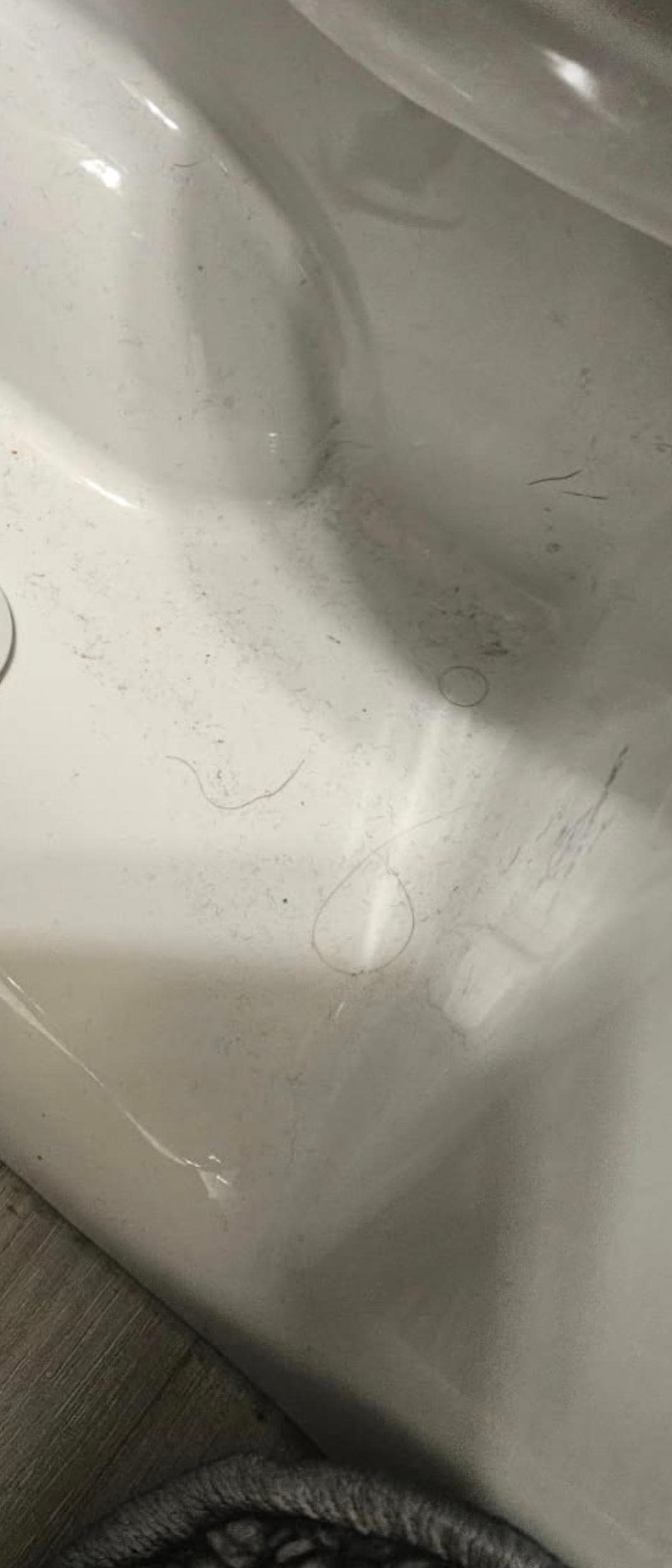 Hairs around toilet.