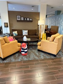 Entry area. Other side has tv, comfy chairs and tables with chairs for breakfast area.