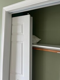 Closet door broken and off the track.