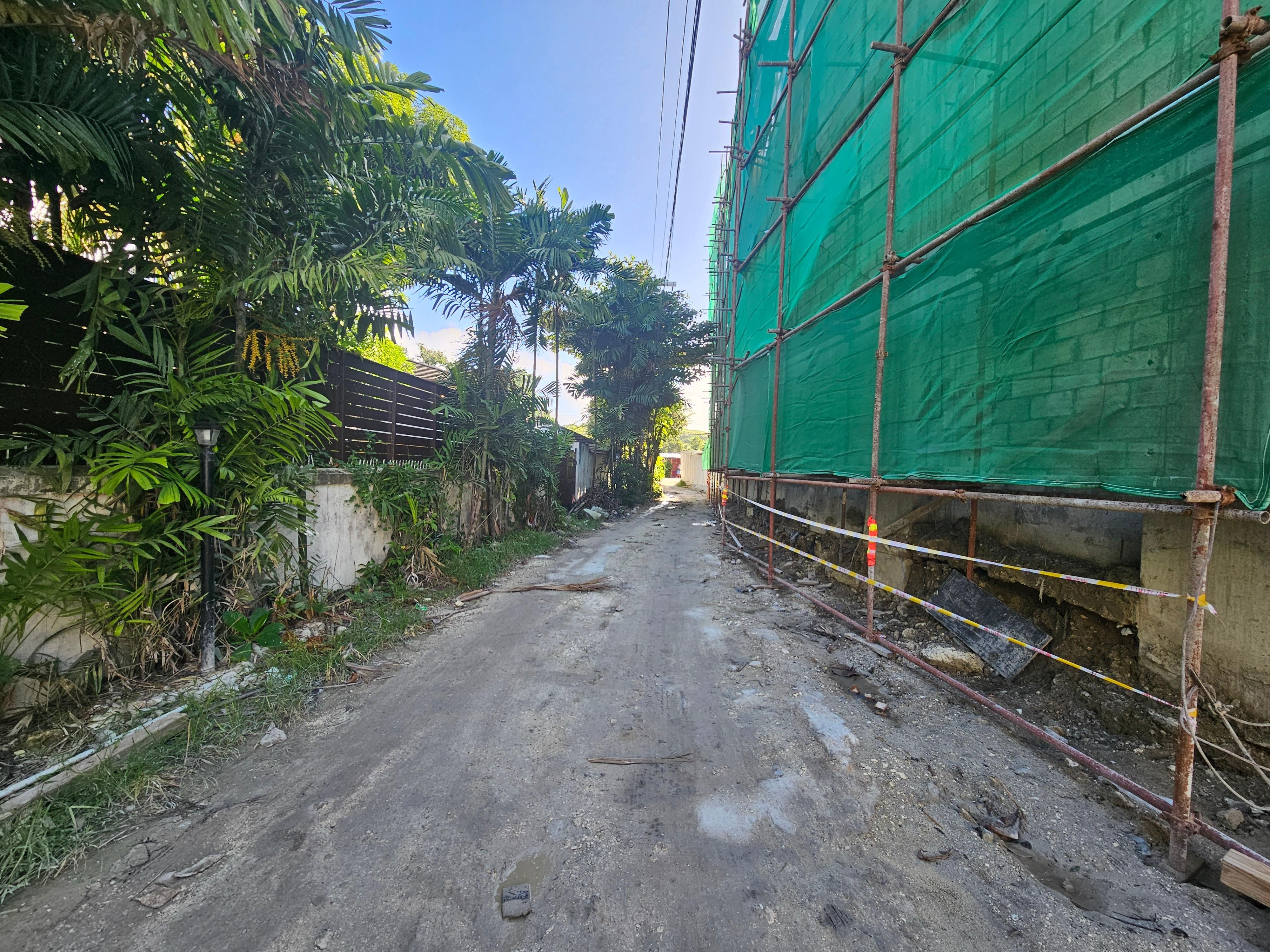 The currently narrow access road.