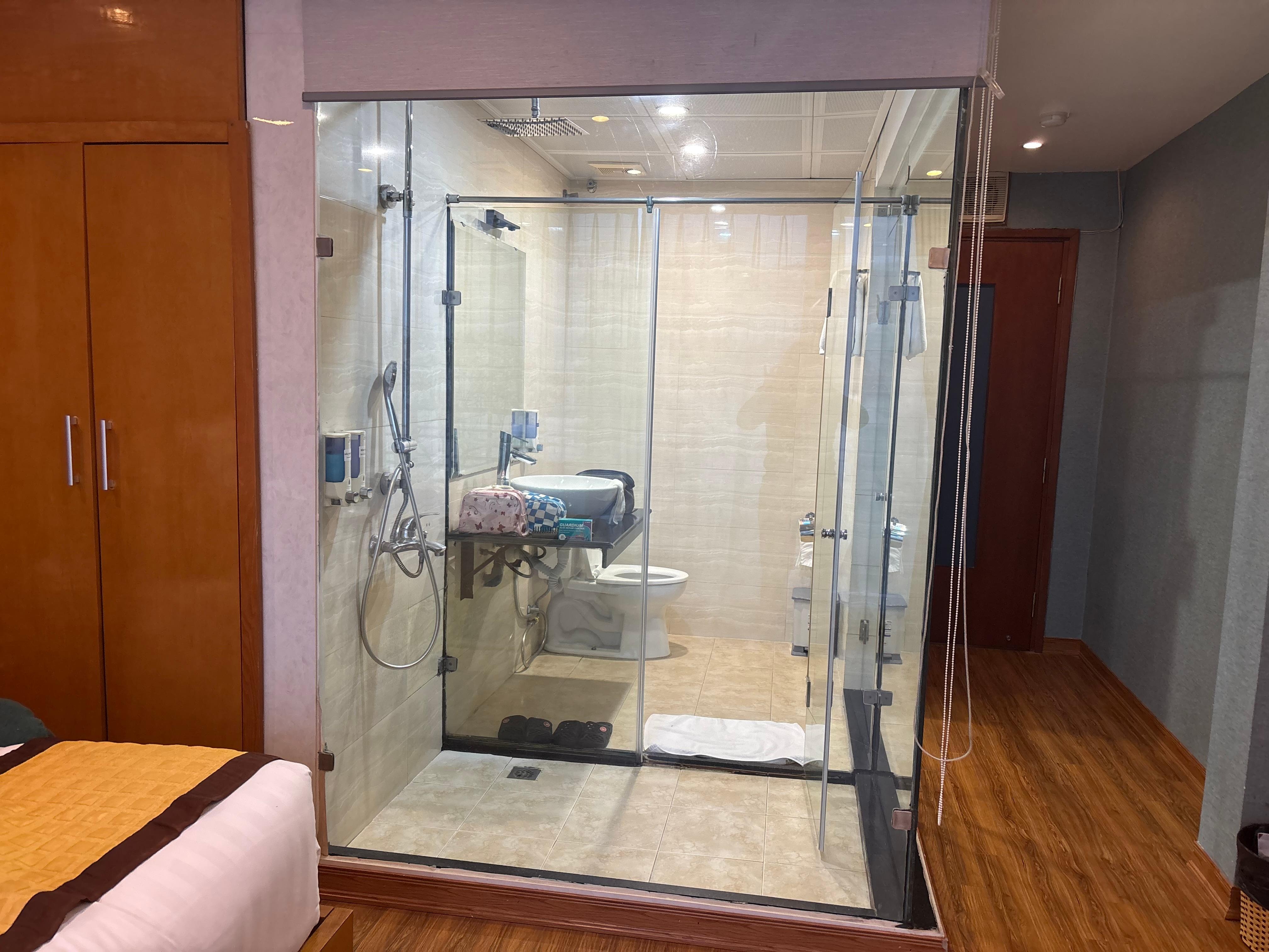 There are blinds which screen off the bathroom