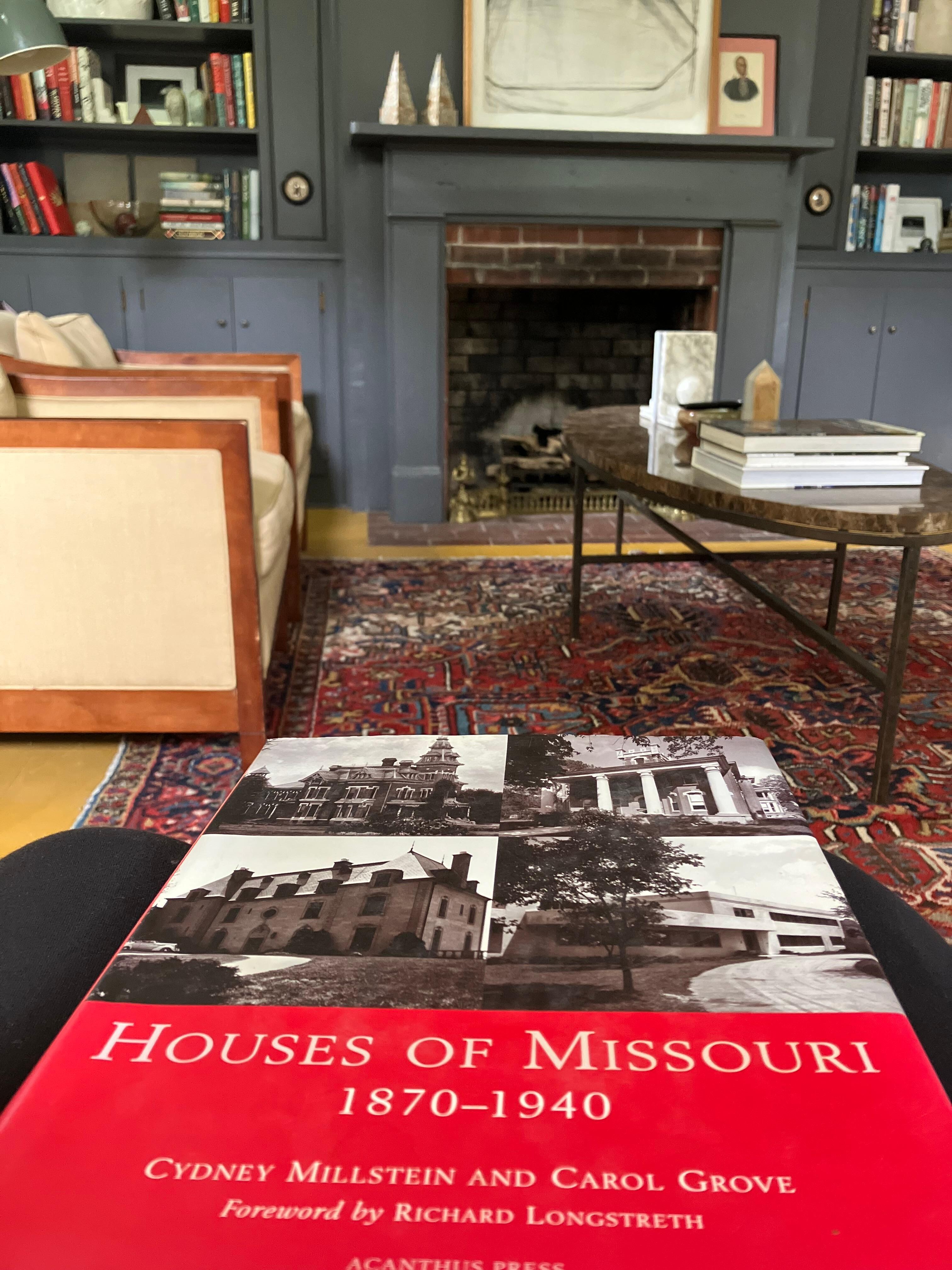 Reading a book about Missouri Historic homes on the comfy leather couch.