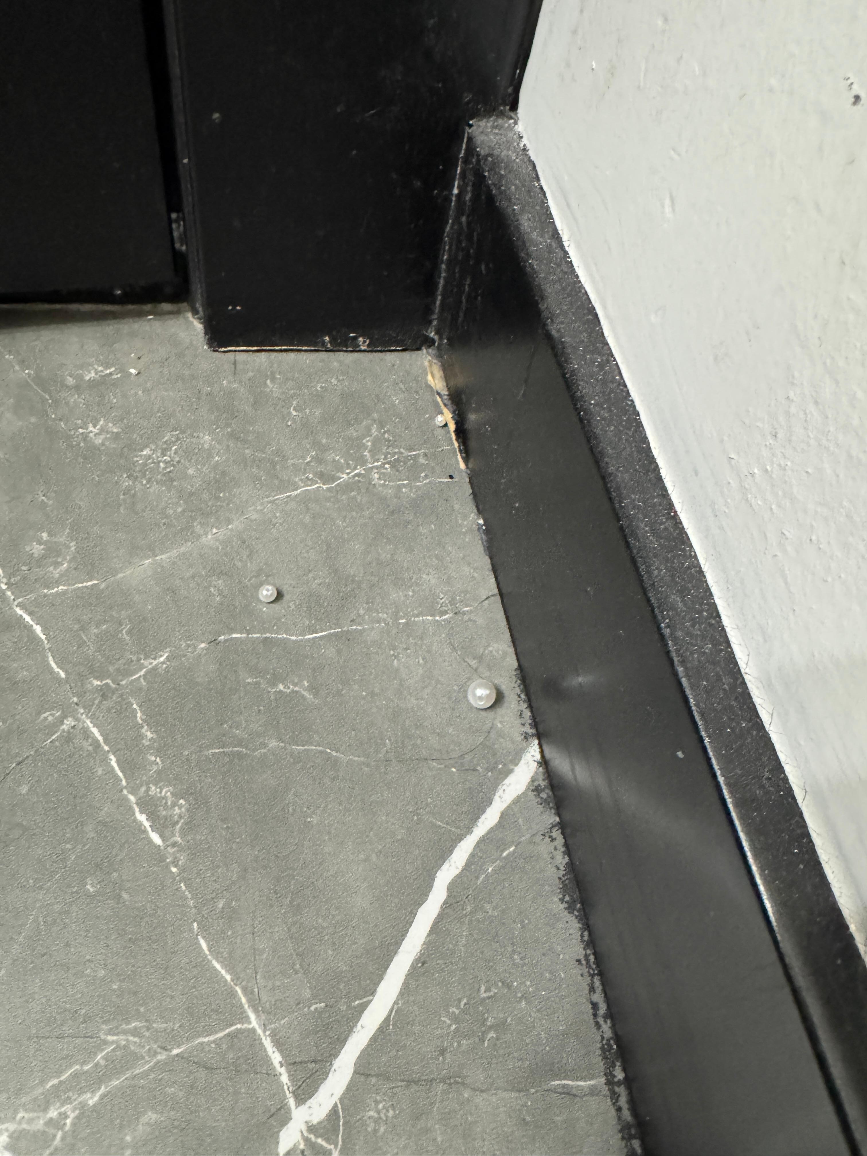 Beads on the floor from previous stay ??