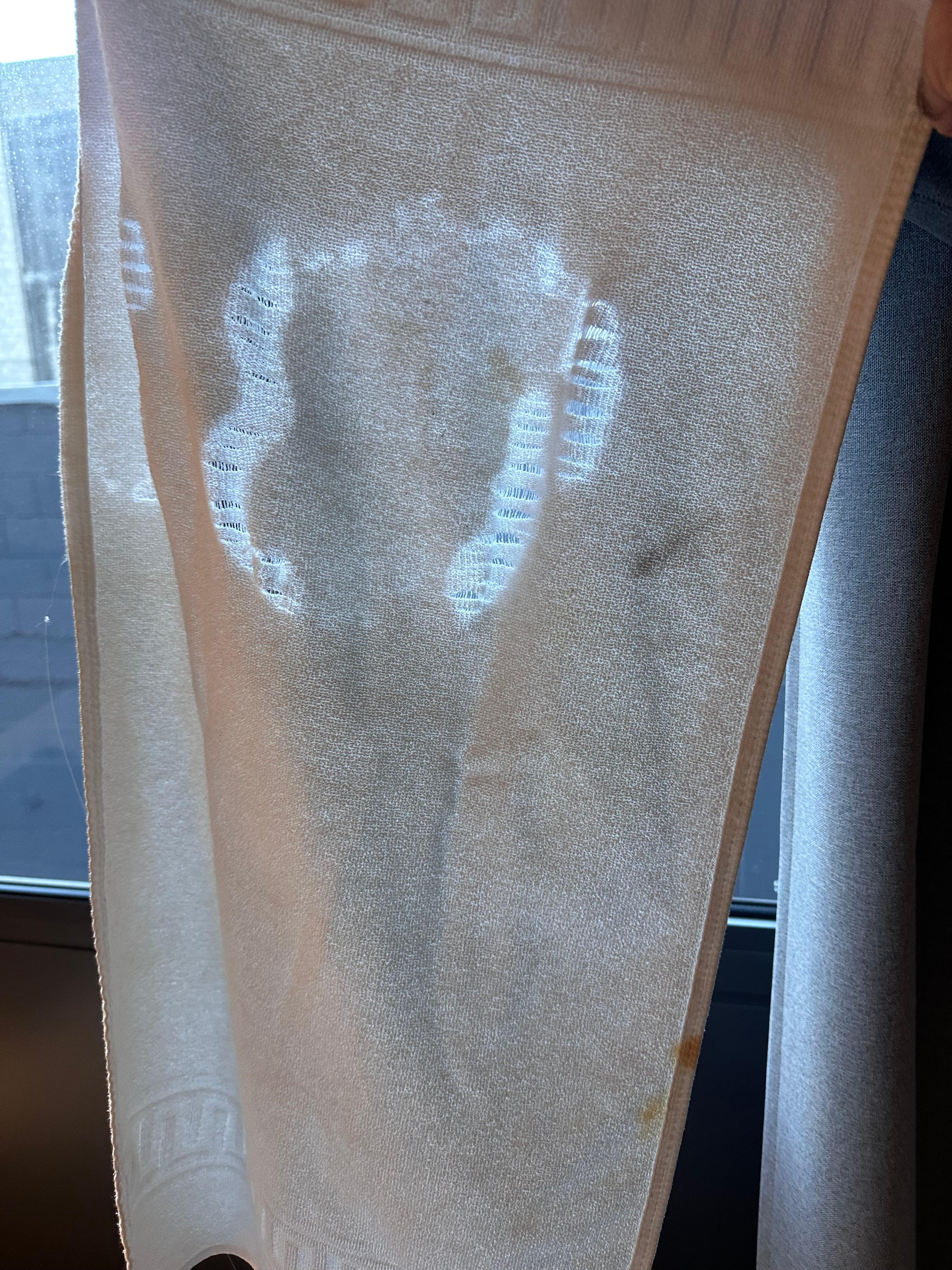 One of two stained and torn towels upon my arrival. Folded up as if brand new to use. 