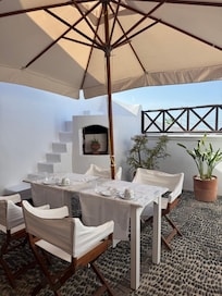 Our private patio. Used both elevated areas for the views. Note everyone stands at the railing to get photos of Oia. Didn’t really bother us but if you put privacy high on your list this would not suit.
