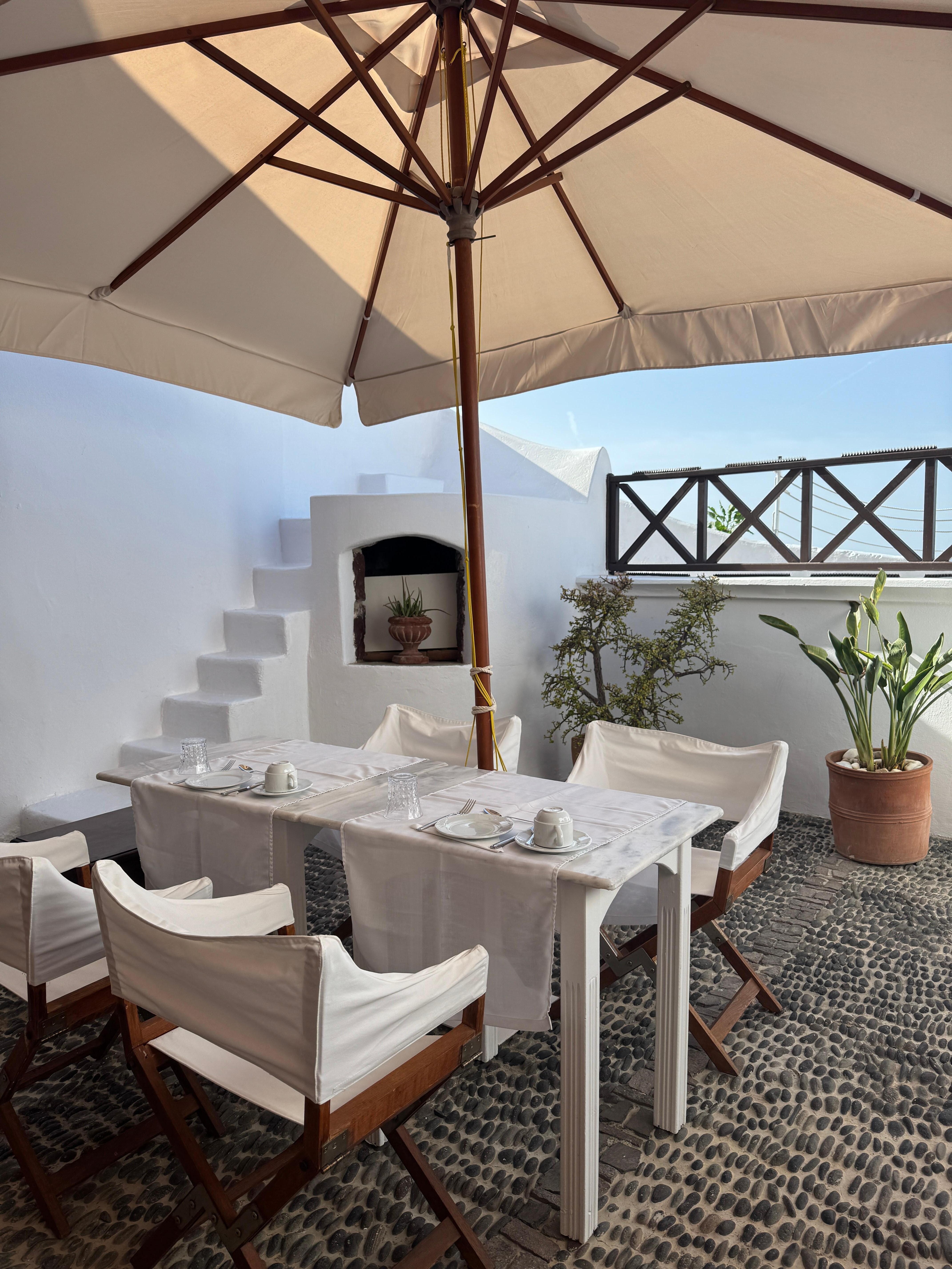Our private patio. Used both elevated areas for the views. Note everyone stands at the railing to get photos of Oia. Didn’t really bother us but if you put privacy high on your list this would not suit.