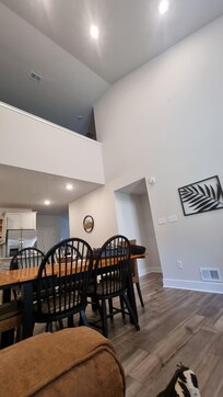 A look from the living room area to the kitchen and 2nd floor