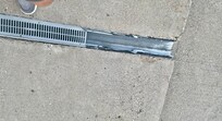 Broken drain in sidewalk. Tripping hazard!