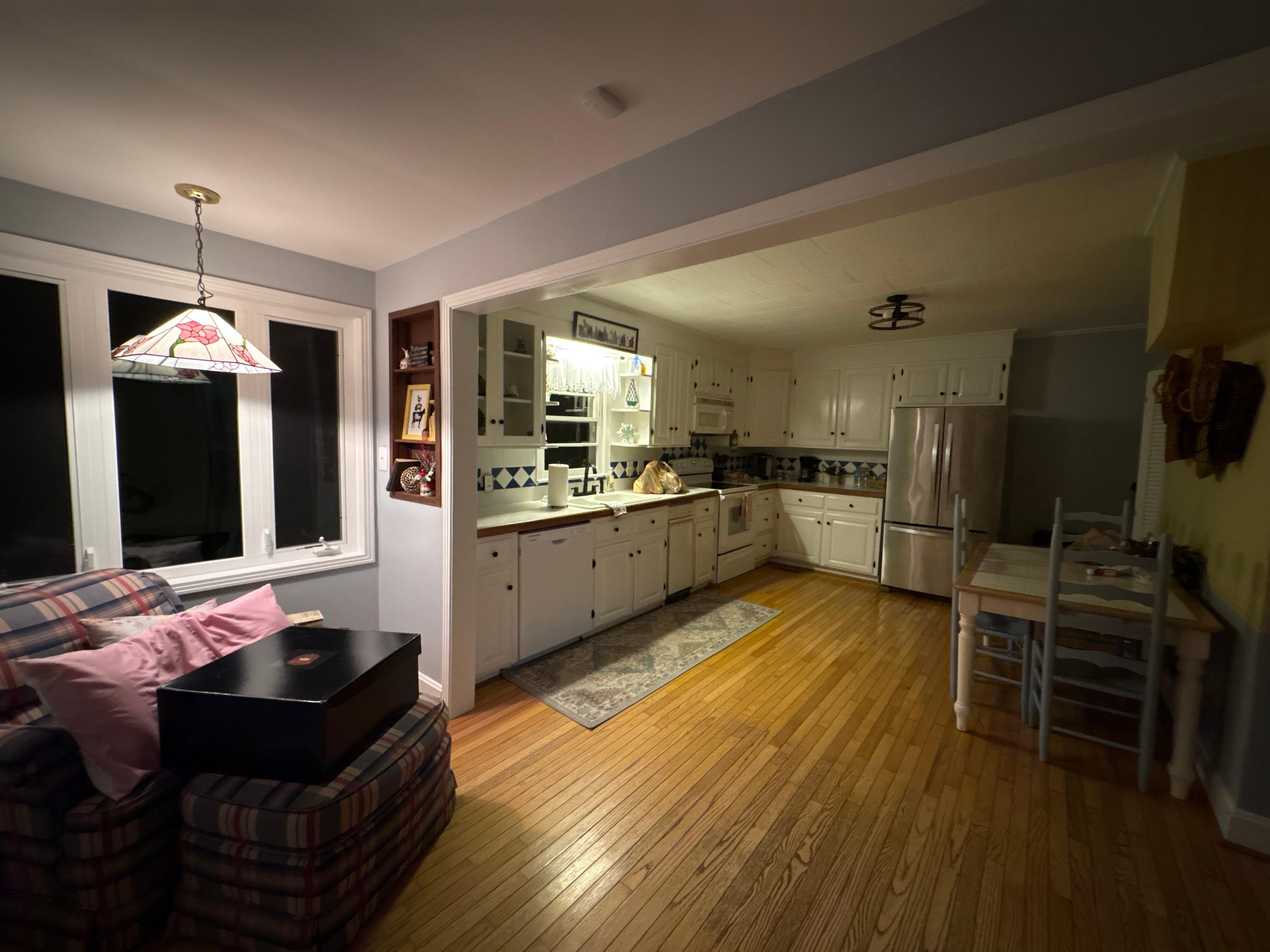 The kitchen and dinning area with an antique look and feel yet so clean and neat!