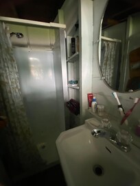 Shower/sink area with toilet. Plenty of hot water.. great water pressure.