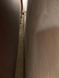 Behind bed in master bedroom