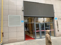 The elevators are through the door on the north side of the building, past the Starbucks and Pizza Hut. Go to the end of the building, take a left, and go past the department store entrance.