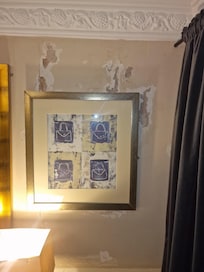 Hidden behind picture flaking plater/paint