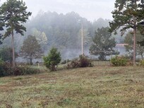 The lake in the morning with beautiful fog.