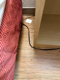 We just checked in. Next to the bed.