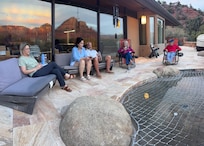 The evening reflection of the mountains in the glass on the back patio