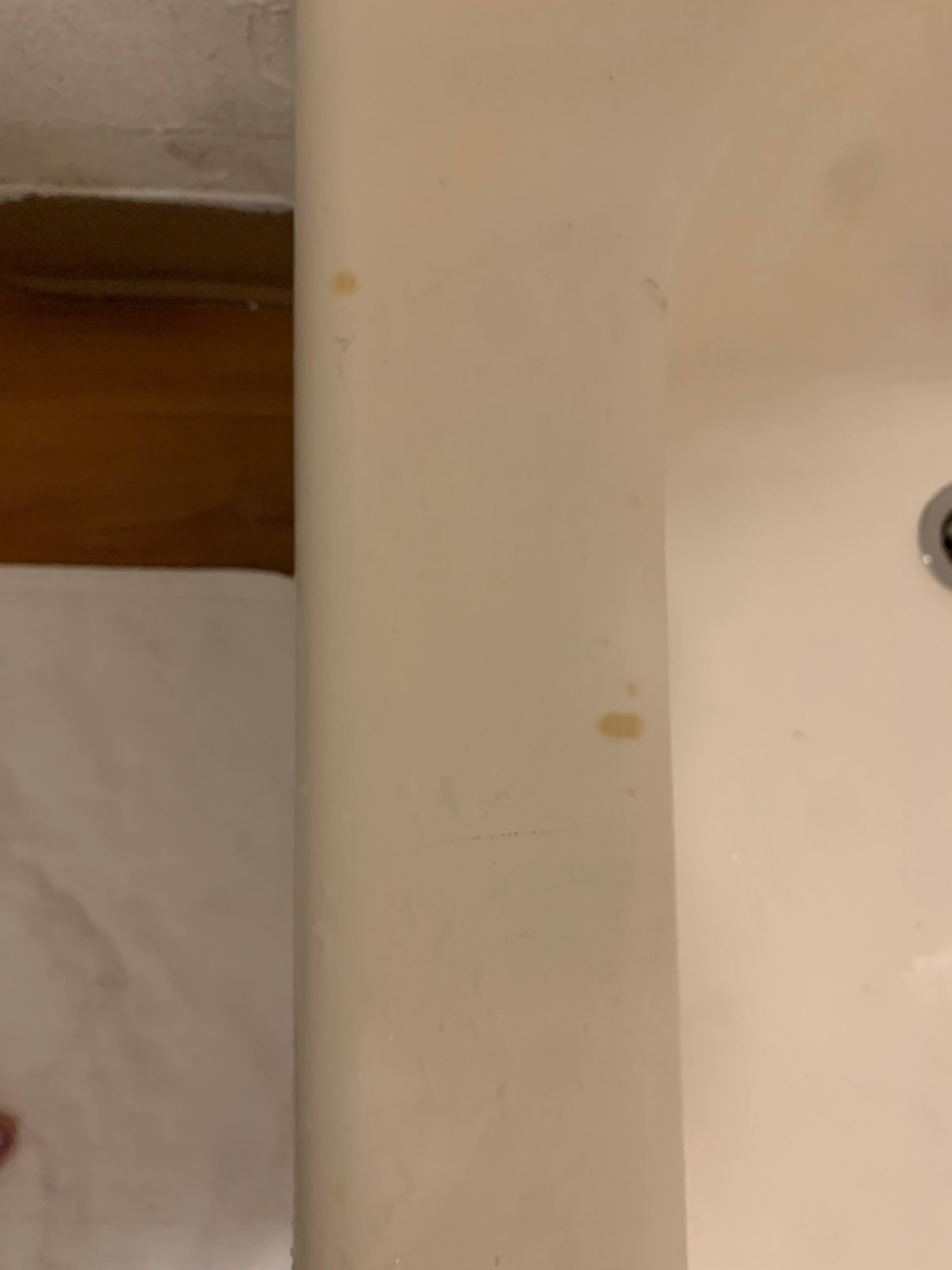 Paint peaking off bathroom wall