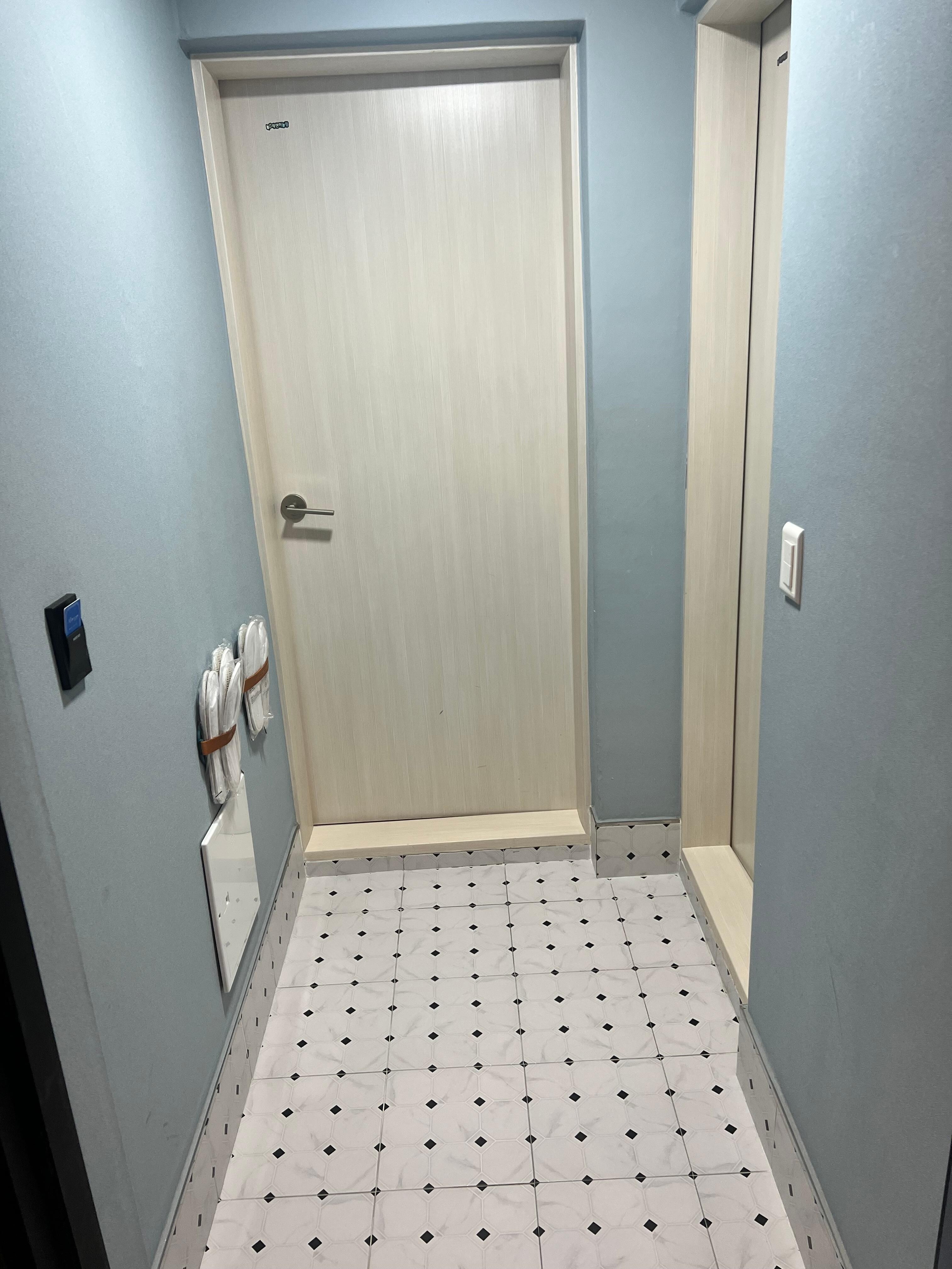 The room entrance where you remove your shoes and also connect to the bathroom. Very nice and clean and includes slippers!