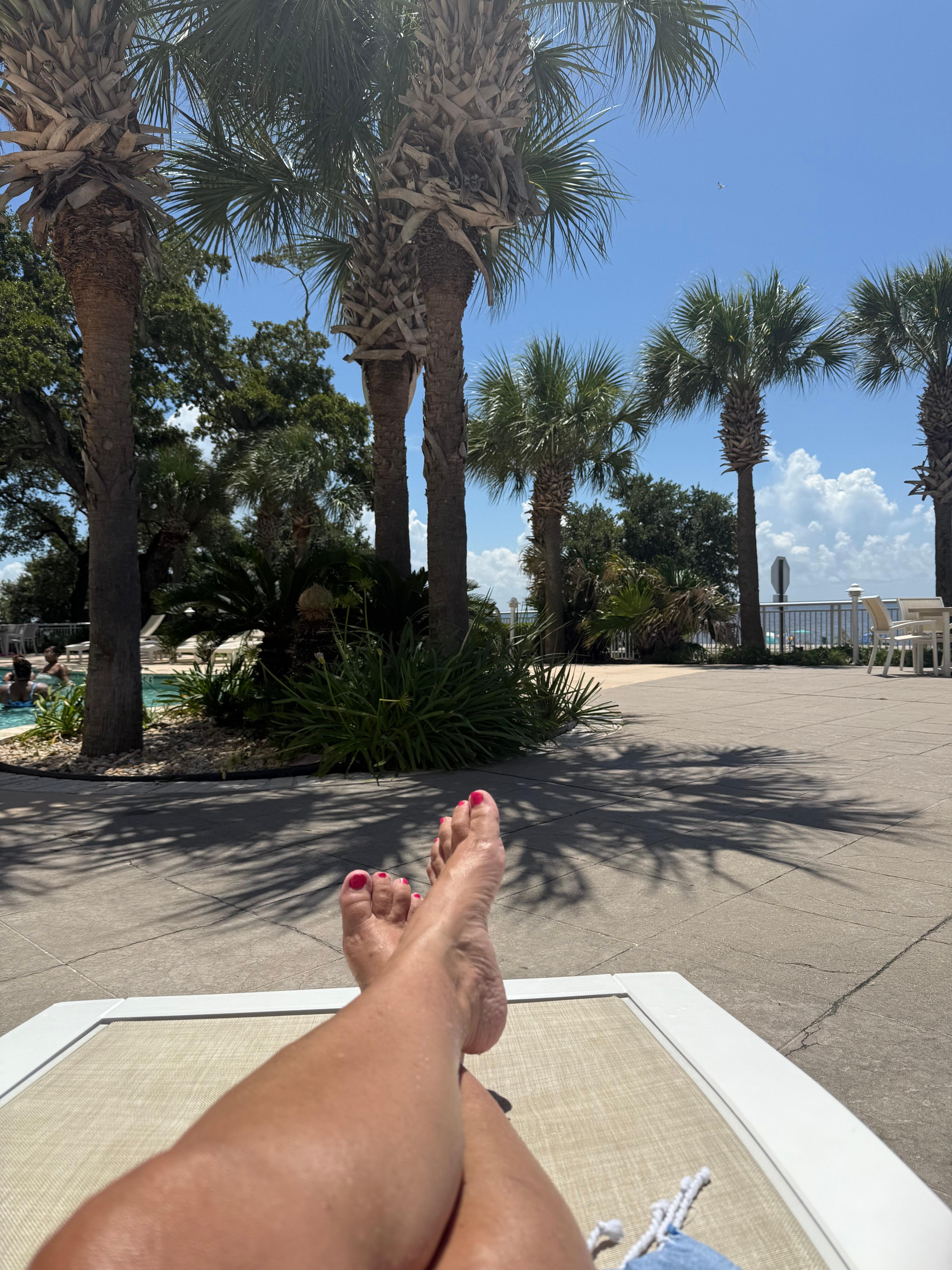Pool side relaxing with view of beach and Gulf 