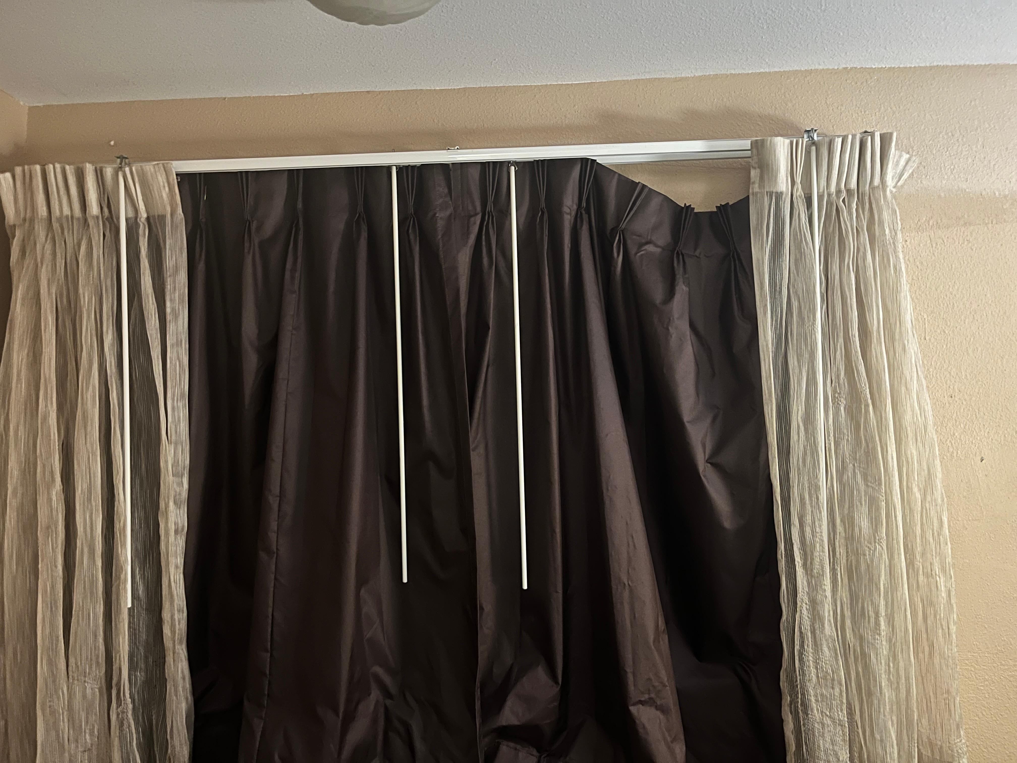 Window curtain half way off and hard to fix 