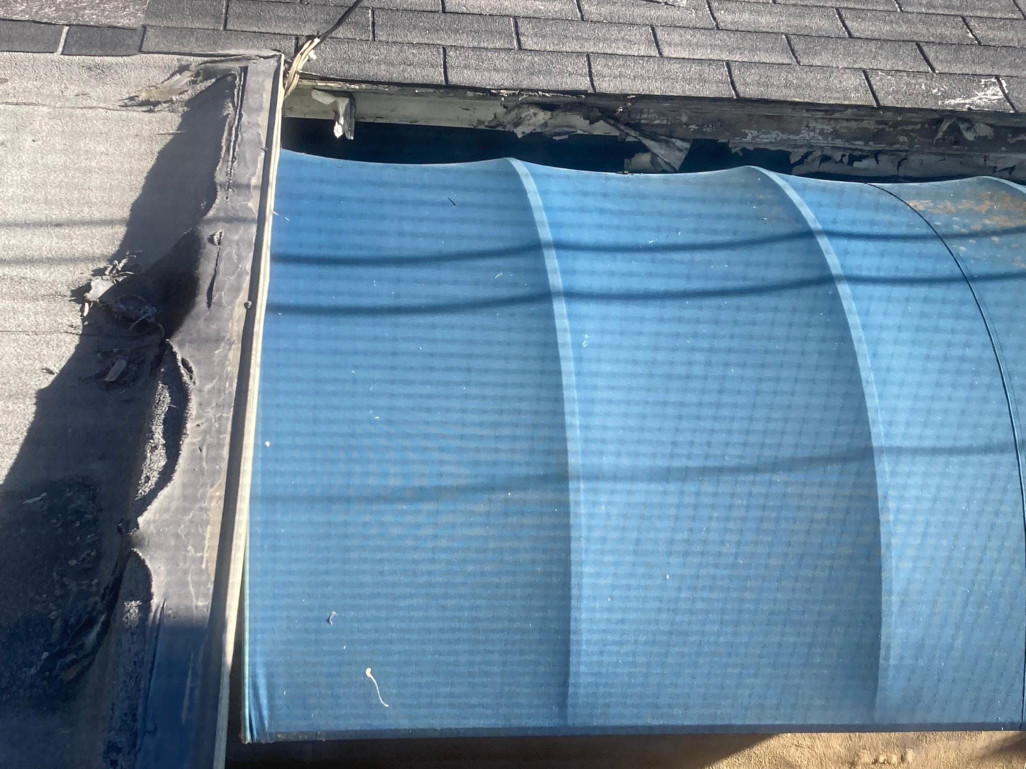 View of dilapidated roofline from our window.