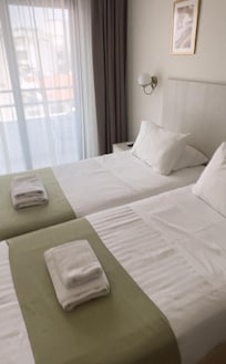 The room. The bed is so fresh and clean