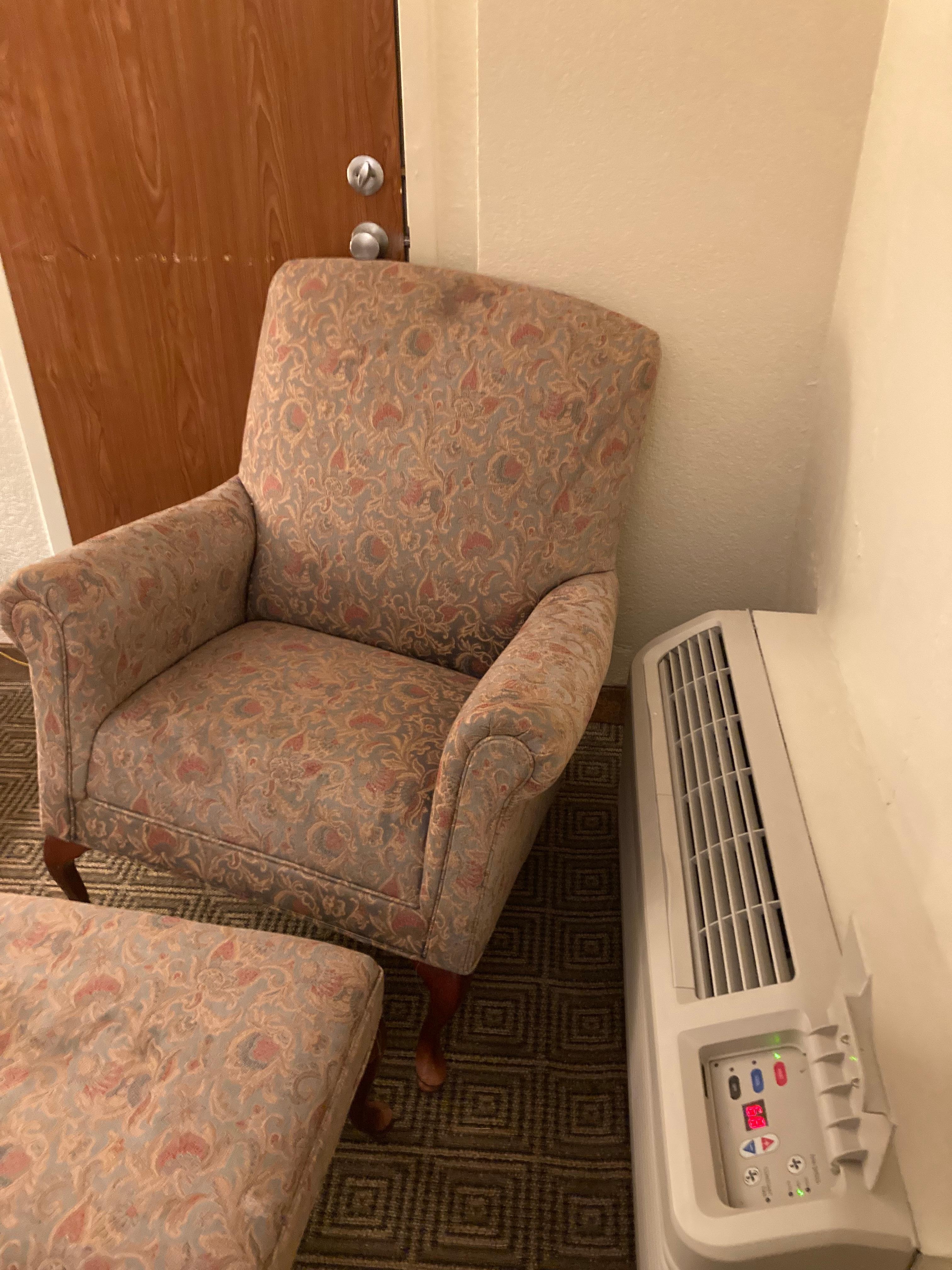 3-legged chair wedged under the doorknob to the connecting room.