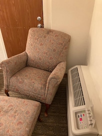 3-legged chair wedged under the doorknob to the connecting room.