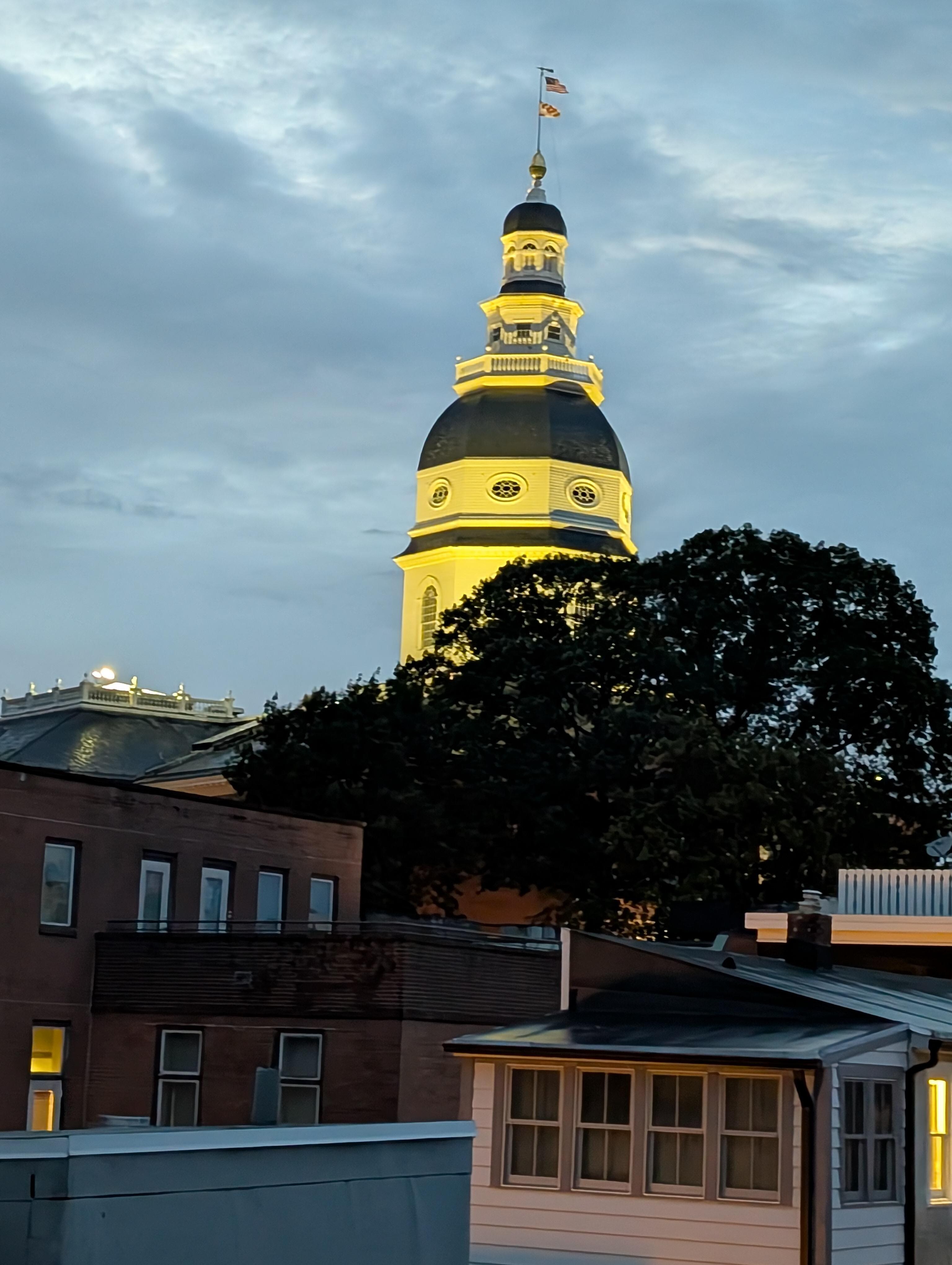 the state house at night from the deck