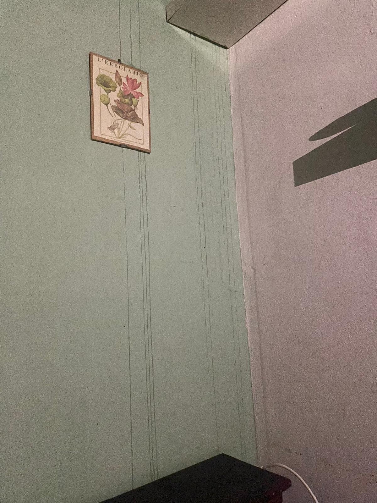 Water pouring down wall in the middle of the night