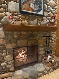 Relaxing by the fireplace. Cool enough in the summer nights to enjoy!