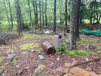 Backyard was full of trash including a sink!