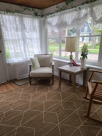 The enclosed porch is a lifesaver for unloading groceries or bags from your car during inclement weather. A great space for shedding damp coats and shoes before entering the house.