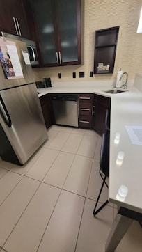 Nice, full kitchen. Living room with sofa and a king bed with a large bathroom