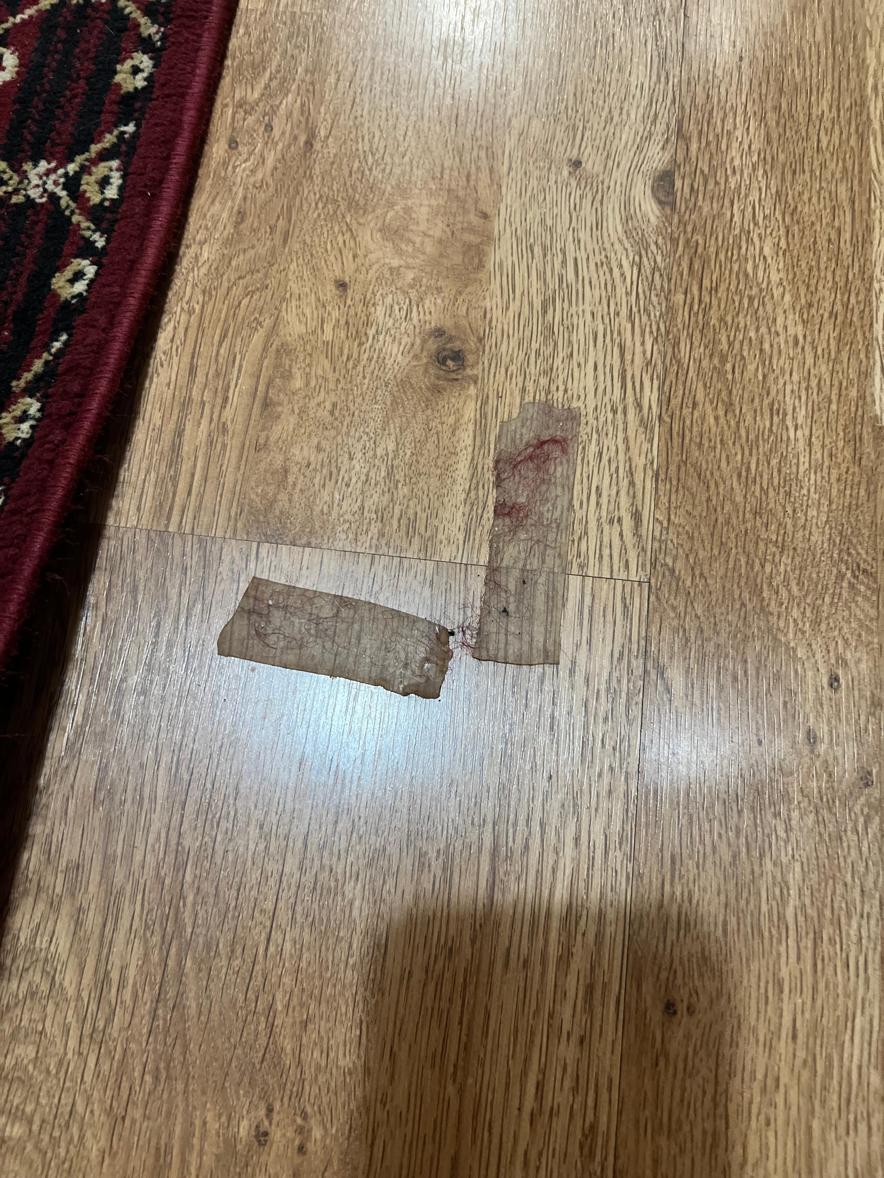 Dirty tape stuck to the floor.  
